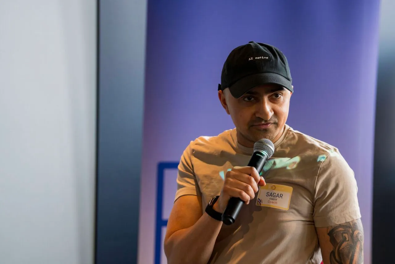Sagar Pandya speaking on stage